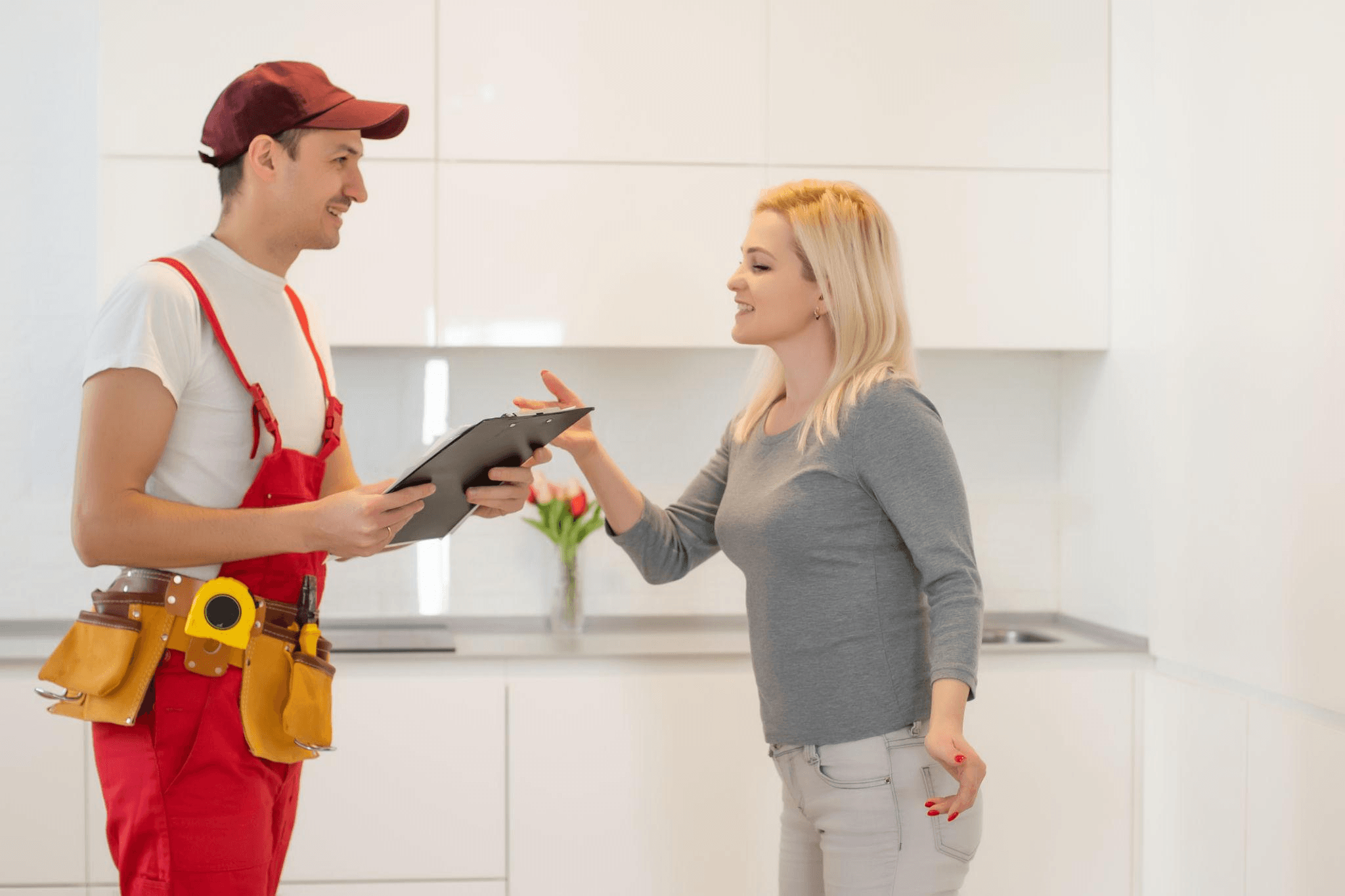 Friendly appliance repair engineer with customer